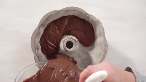 Time Lapse Step By Step Flat Lay Chocolate Cake Batter in a Metal Bundt Cake Pan Ready for Baking