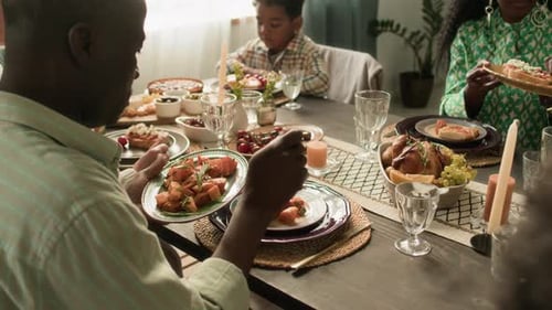 Family Sharing Meal Together at Dining Table