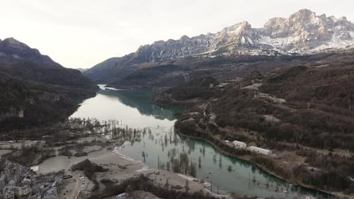 Aerial Low Water Level Revealing Rocky Terrain of Banos De Panticosa Reservoir Mountain Range