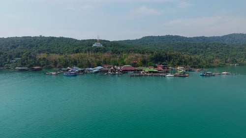 Loh Chang Island with Houses and Boats on the Sea Waters From a Drone View