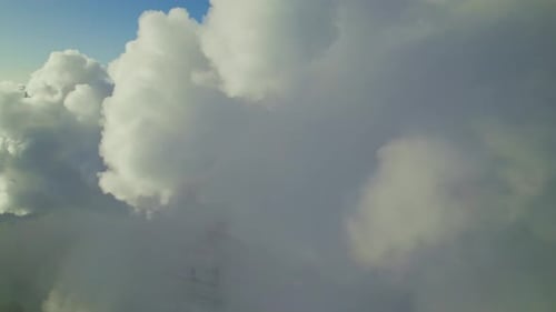 Cloud Formations Dominate the Sky Over a Stunning Mountain Landscape at Sunset