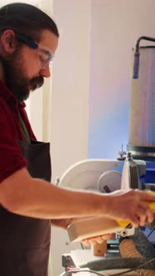 Vertical Video Coworking Artisans in Studio Using Sandpaper and Wood Shaper