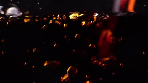 Dark Liquid with Swirling Orange Embers