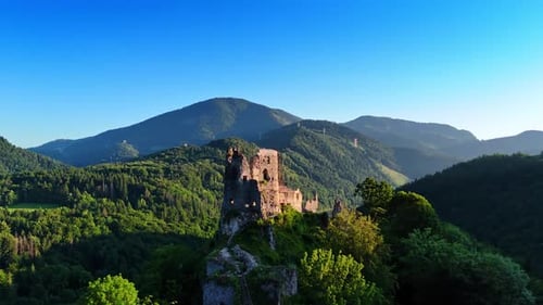 Flying around the rock with the castle ruins on top.