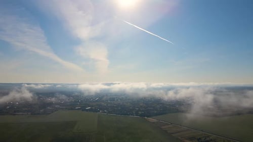 Top View From Above of Landscape Covered with Puffy Morning Fog