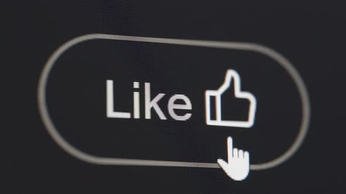 Clicking the like button on black background screen