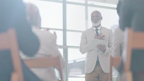 Presentation, meeting and man speaker with applause from audience for conference, seminar and event