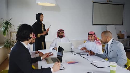 Diverse Business Professionals Collaborating in a Meeting