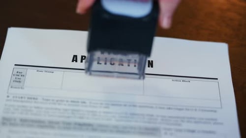 Visa Application Stamped Denied on Wooden Table