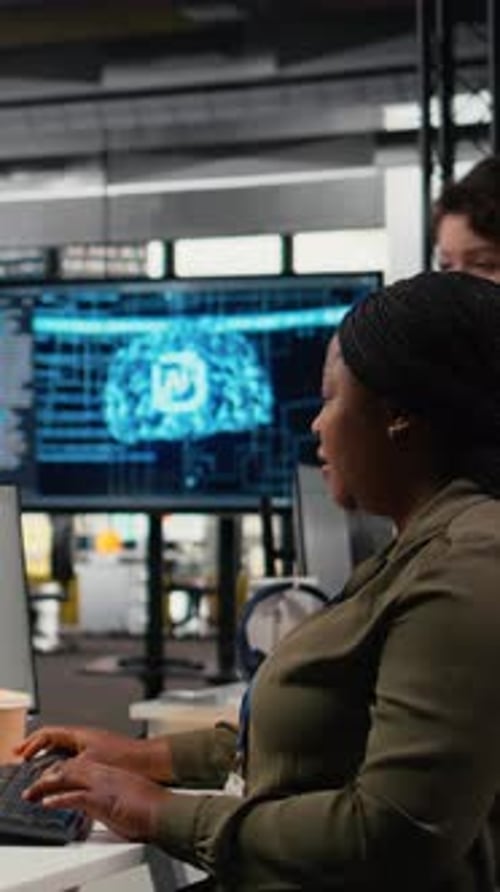 Vertical Video Technicians Doing Brainstorming in Office Using AI Specialized Hardware