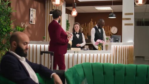 Hotel Lobby with Guest Checking In