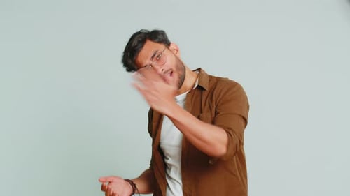 Smiling Man Greeting and Gesturing Positively