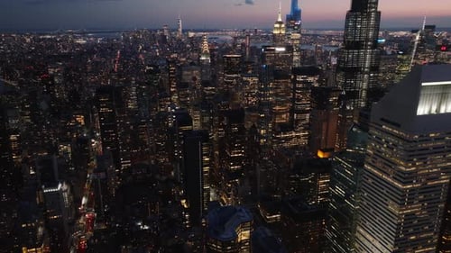 Aerial view of illuminated skyline at night, United States.