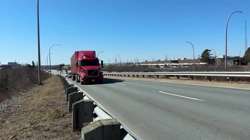 Big Semi Trailer with Cargo Trailer Moving on Road with Cars Low View Angle
