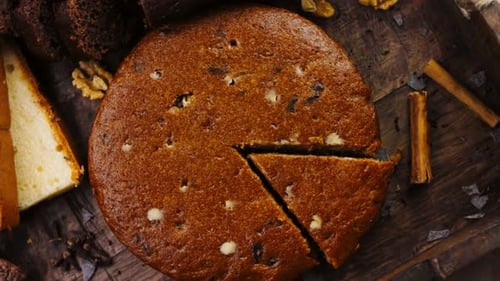 Different Kinds of Cakes Arranged on a Wooden Tray