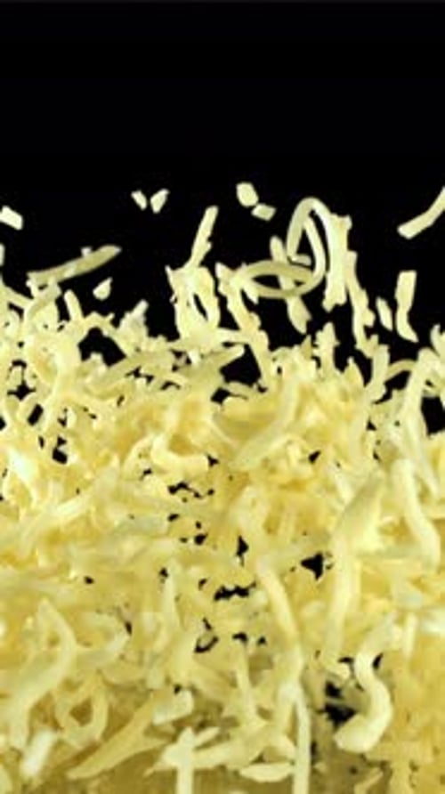 The Grated Cheese Flies Up and Falls Down Filmed on a Highspeed Camera at 1000 Fps