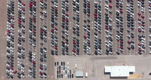 New Cars Parked for Sale on Automotive Factory Parking Lot Dealer Vehicle Inventory for Import and