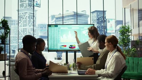 Business Associates Reviewing Key Performance Indicators Within the Enterprise