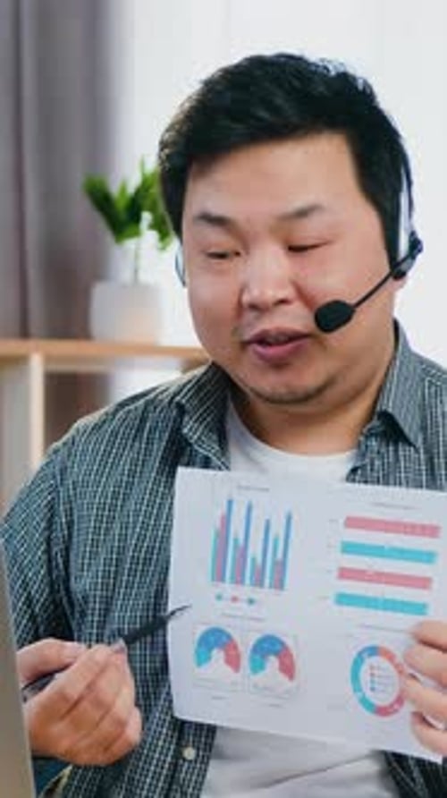 Adult Man Explains Business Charts During Online Meeting