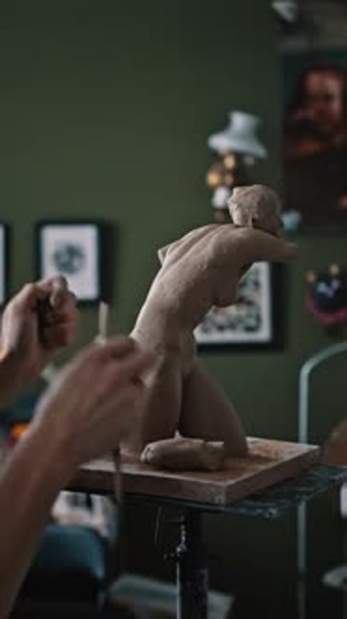 Male Sculptor is Modeling Clay Figurine of a Naked Female Body in a Creative Potting Garage Studio