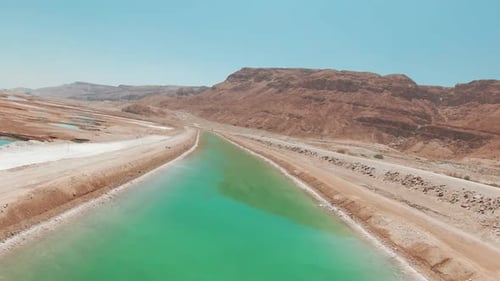 Sinkholes and Salt water canal landscape at the Dead Sea, Aerial view