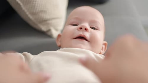 Cute Infant Lies on Couch, Tummy Time