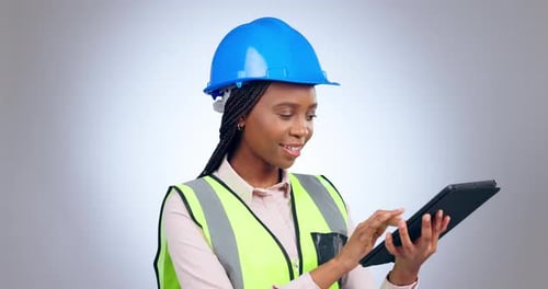 Woman, construction and engineering with tablet in studio of project management