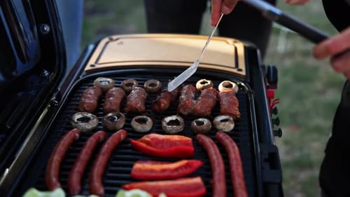 Grilled Sausages, Mushrooms, Peppers and Meat Rolls