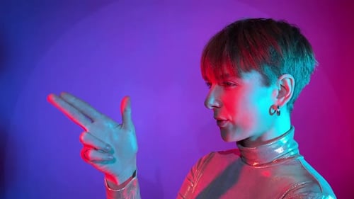 Stylish Young Adult Posing with Hand Gesture