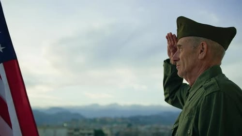 Elderly Man Stand Against American Flag For Veterans Day Holiday