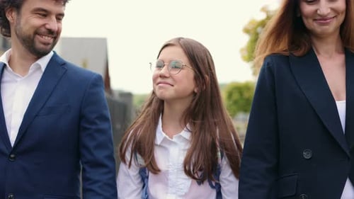 Cropped View of the Caucasian Beautiful Mother Father and Their Cute Happy Daughter Walking From