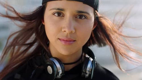 Closeup of a young, funky and cool woman sightseeing in the city