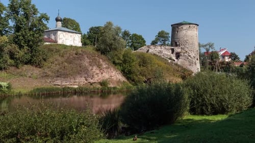 Gremyachaya fortress tower and the ancient Church of Kozma and Damian in Pskov