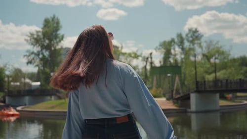 Relaxed Lady By Water Serene Female Individual Enjoying Leisurely Walk Outdoors Calm Woman Ambles
