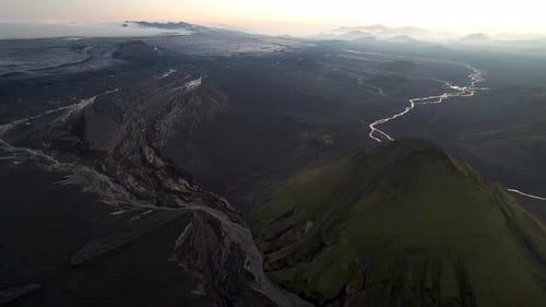 Aerial view of Maelifell mountain at sunset with valley landscape, Iceland.