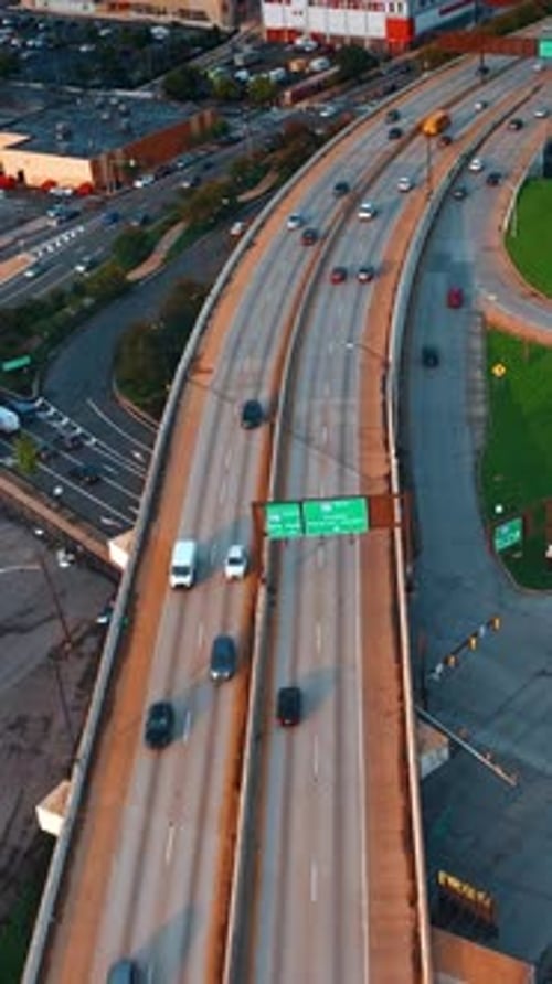 Flying above the highways with lively traffic. Philadelphia roads from aerial perspective.