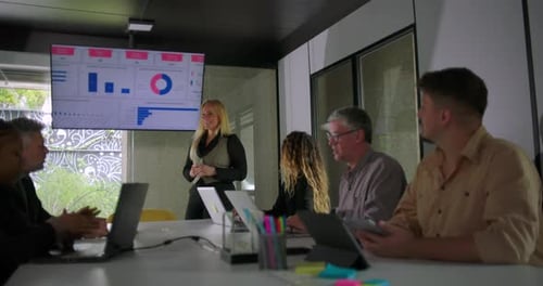 Business Professionals Discussing Data in Modern Office