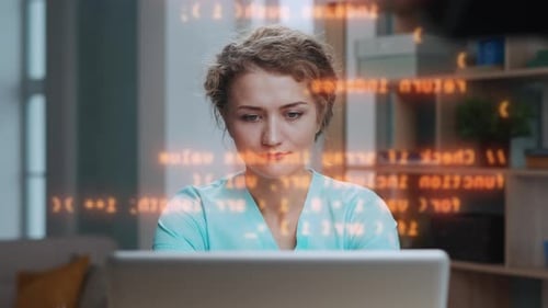Successful Woman Working on Program Code at Laptop Computer in Home Office Room