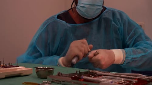 Rack focus of dentist adjusting tools for procedure, professional setup in clinic