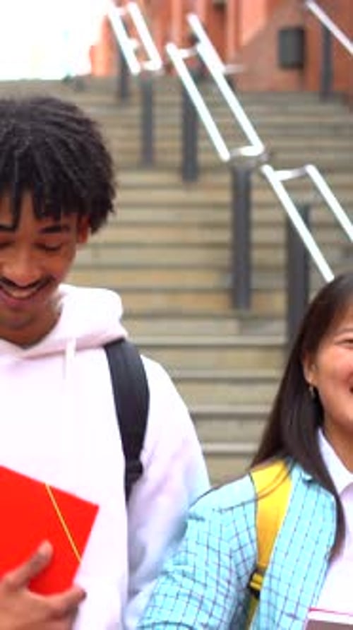 Portrait of Three Multiethnic University Students Embracing Together