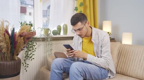 Frustrated Man Receiving Bad News on Mobile Phone