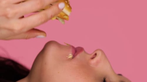 Woman Eating a Burger in Close-up
