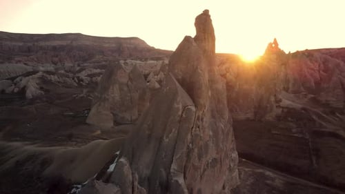 Sunrise in Cappadocia red valley of fairy chimneys , Aerial drone flight