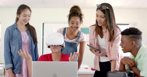 Diverse group of teenagers in high school explores virtual reality, with one wearing a VR headset