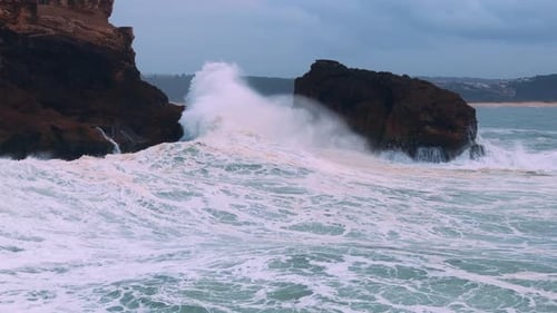 Ocean Waves Crashing Against Coastal Rock Formations