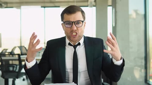 Angry Businessman Yelling in a Modern Office