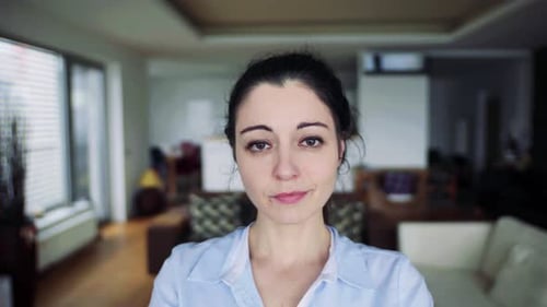 Woman Opening and Closing Eyes in Home Interior