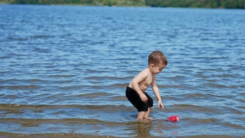 Water summertime lifestyle. Summer child having fun on a river.