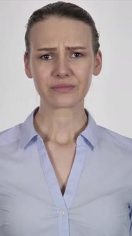 Sad Young Woman Expressing Grief and Crying