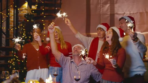 Happy Family Celebrating Christmas with Sparklers